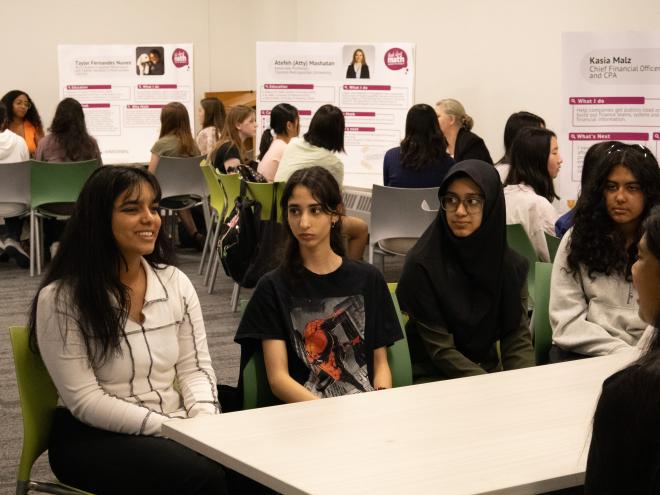 Students belonging to underrepresented genders in math discussing careers in math at the Think About Math workshop in 2024