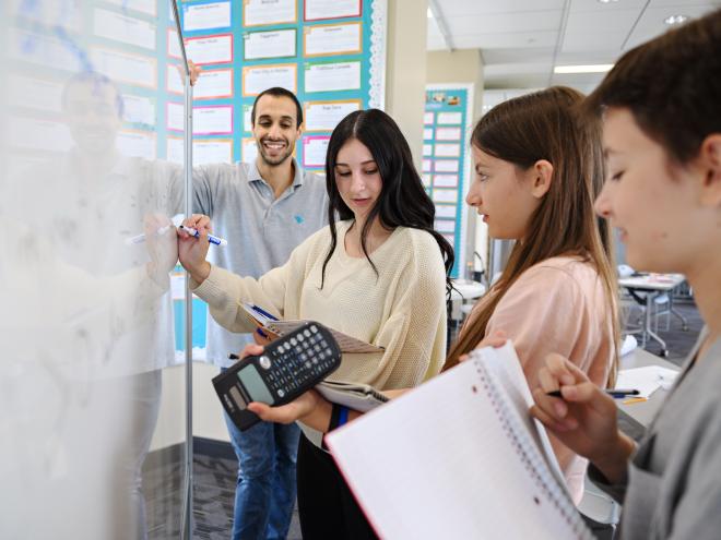 Students studying along with their educator