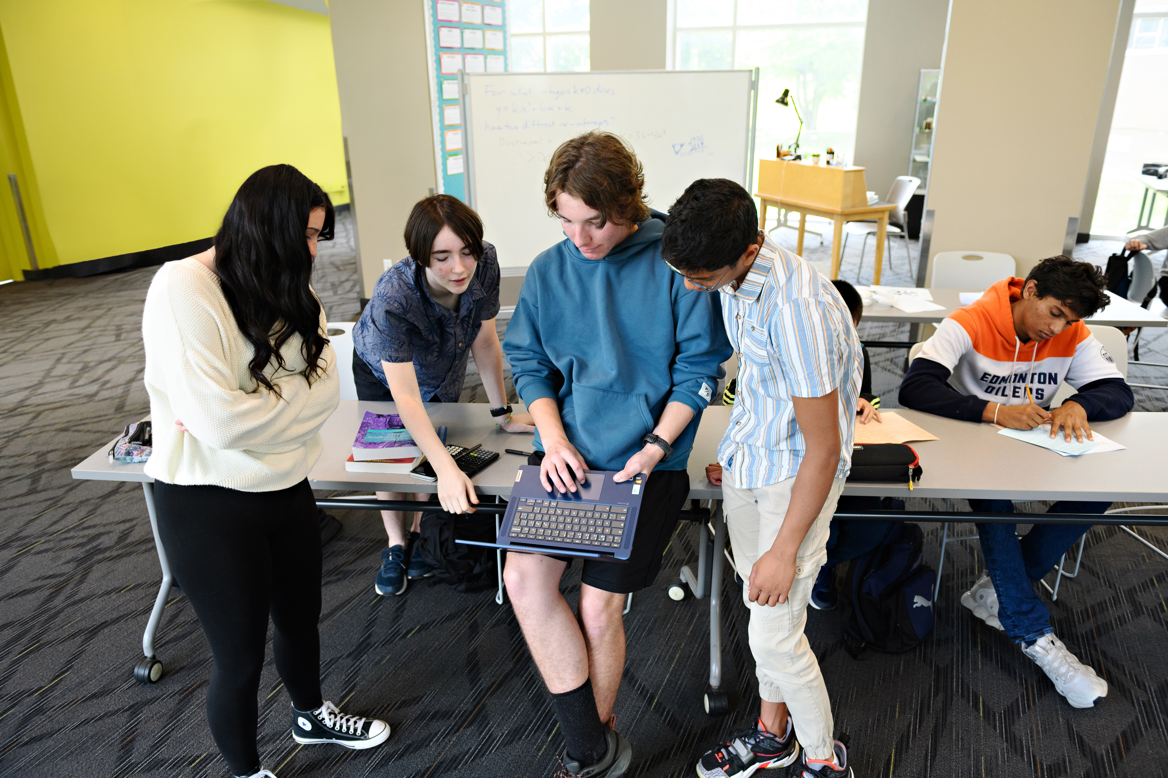 Students engaged in online learning together