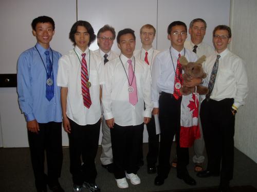 IOI 2006 team from Canada: Peng Shi, Qiyu Zhu, Gordon Cormack, Andy Kong, Graeme Kemkes, Richard Peng (with mascot), Ian Munro, and Troy Vasiga