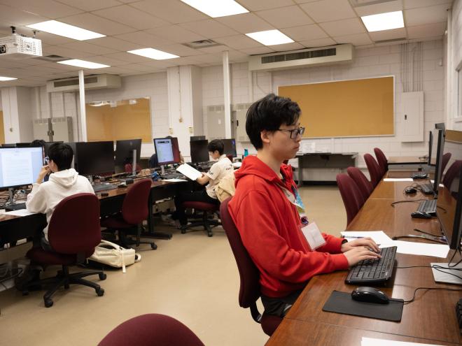 Student working on a computer for an online workshop