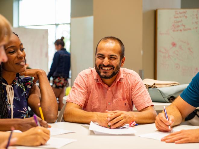 Educators engaged in a conversation about mathematics