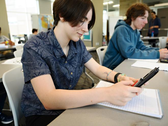 Student sing a calculator for problem solving